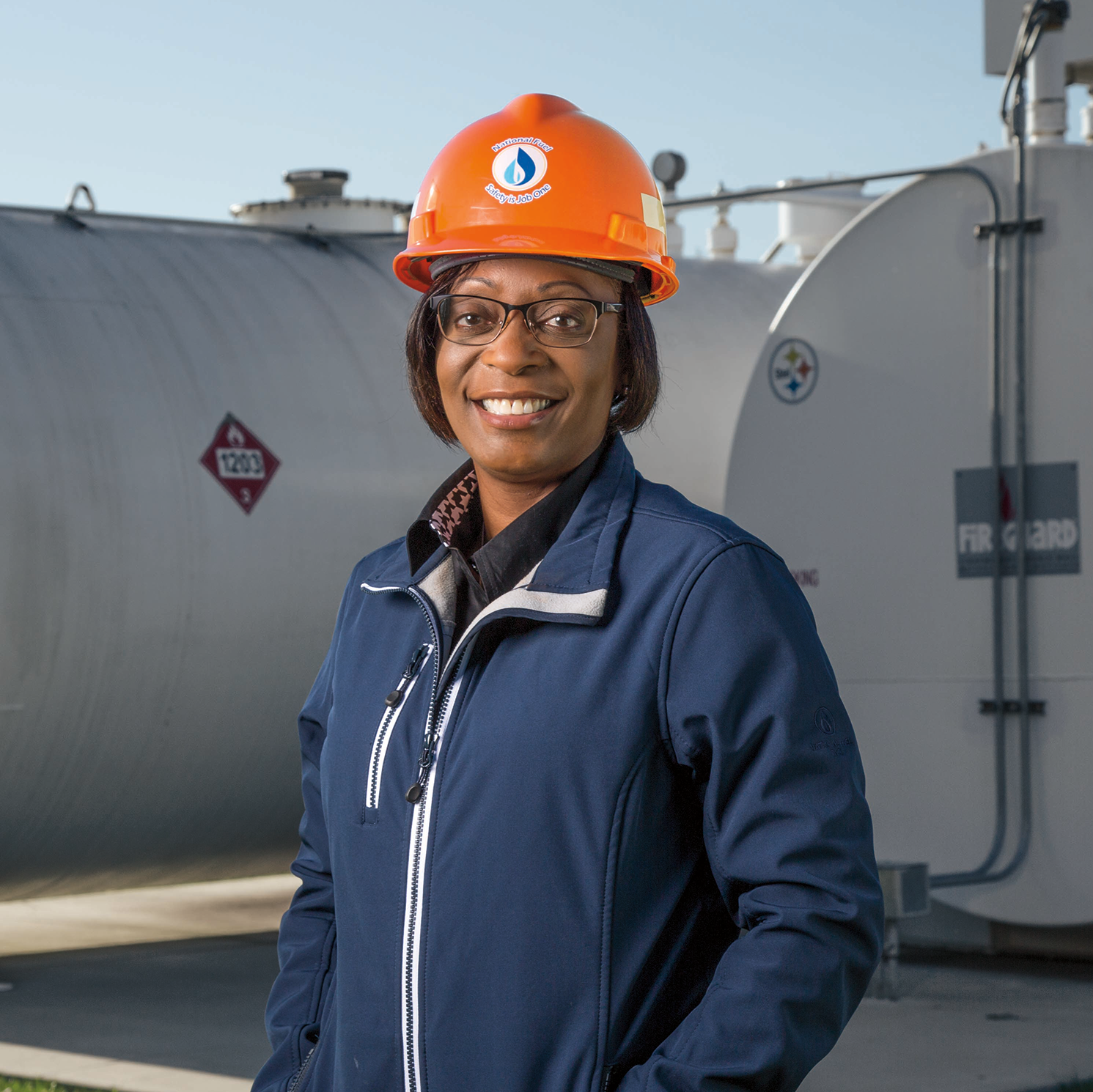 woman in hard hat smiling at camera